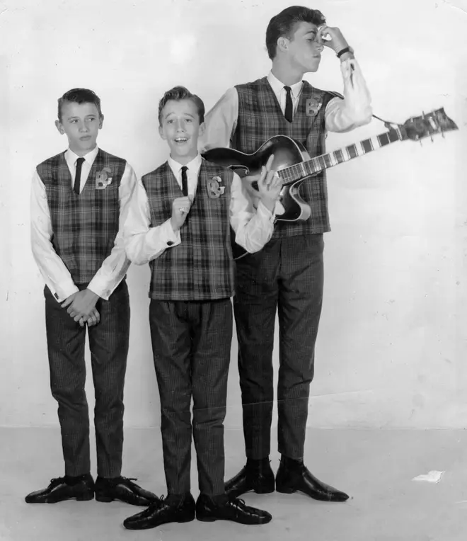 Bee Gee brothers (L to R) Maurice, Robin and Barry Gibb were born on the Isle of Man to English parents, and lived in Chorlton, Manchester until the late 1950s.