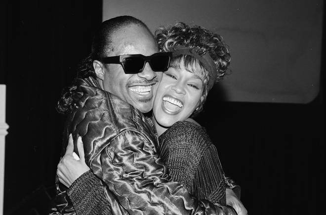 Stevie Wonder and Whitney Houston at a party in circa 1989.