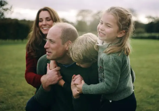 The video shows the Duke and Duchess of Cambridge playing with their children and roasting marshmallows in the garden their home Amner Hall in Norfolk.
