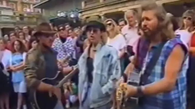 Bee Gees Robin (centre), Maurice (left) and Barry Gibb (right) busked in London's Covent Garden in 1993.