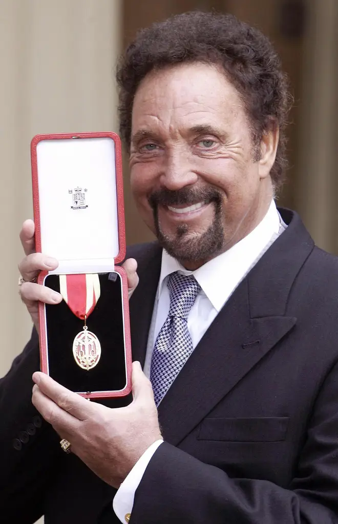 Tom Jones recently revealed that the proudest moment of his career was being knighted by the Queen. Pictured outside Buckingham Palace on 29 March 2006