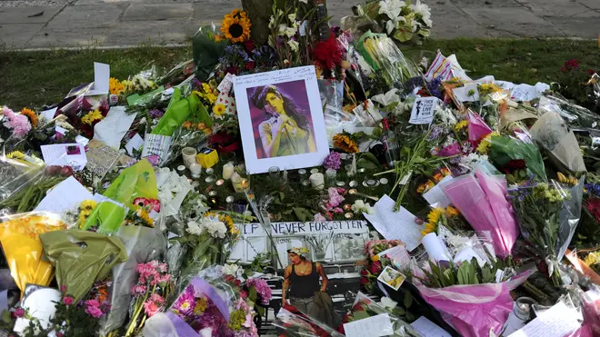 Flowers, pictures and messages are left near Amy Winehouse's home after her death