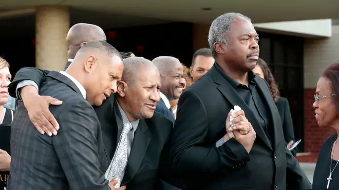 Clarence Franklin (centre) at his mother's funeral in 2018