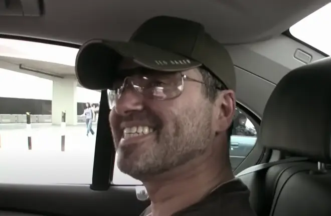 "Sorry, i&squot;d know him a mile away and that is not George Michael!" he says as the camera pans to a very real George Michael laughing in the back of the car.