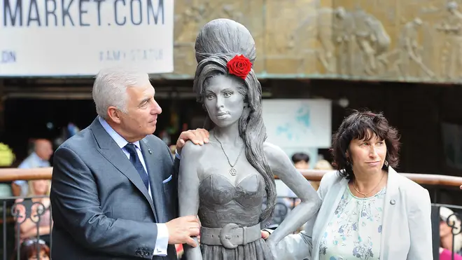 Mitch and Janis Winehouse unveiling daughter Amy's statue in 2014