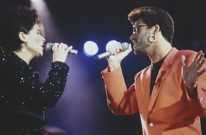 Lisa Stansfield and George Michael performing at the Freddie Mercury Tribute Concert for AIDS Awareness, at Wembley Stadium, London, 20 April 1992. (Photo by Mick Hutson/Redferns/Getty Images)
