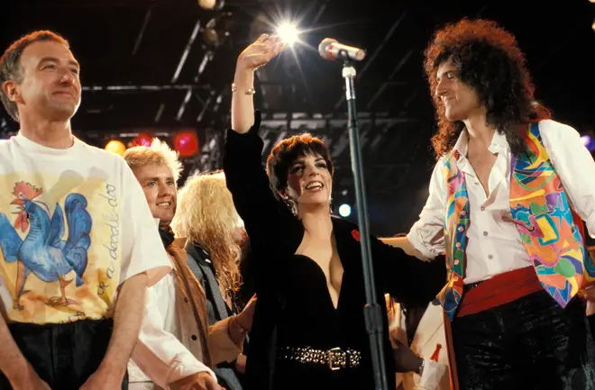 John Deacon, Roger Taylor, Liza Minelli, Brian May performing on stage at the Freddie Mercury Tribute concert (Photo by Mick Hutson/Redferns)