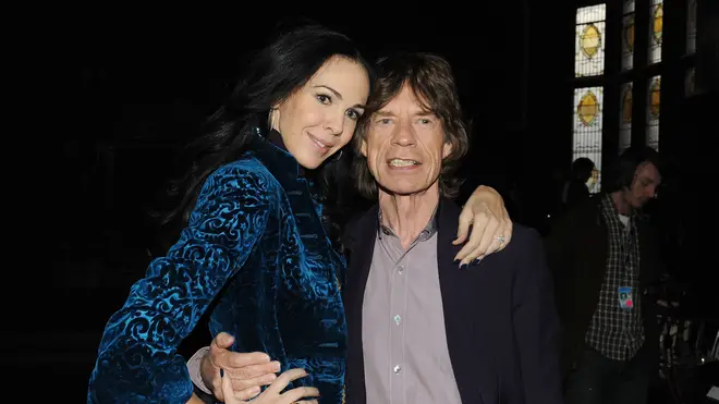 Mick Jagger and designer L'Wren Scott at the L'Wren Scott Fall 2012 fashion show on February 16, 2012 in New York City. (Photo by Slaven Vlasic/Getty Images)