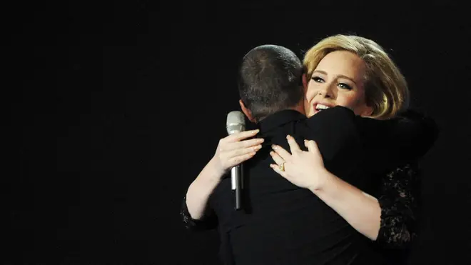 George Michael warmly embraces Adele after she wins Best Album at the BRIT Awards in 2012. (Photo by Dave M. Benett/Getty Images)