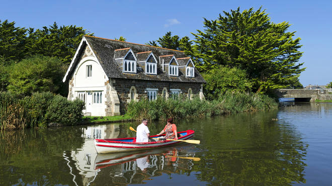On a still day in spring, summer, or autumn, taking out a rowing boat is a great way to both absorb the countryside and get to know someone. ​(Photo by:  Education Images/Universal Images Group via Getty Images