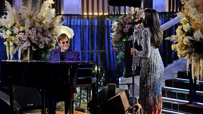 Elton John performing friend and collaborator Dua Lipa at the AIDS Foundation Academy Awards on April 25, 2021. (Photo by David M. Benett/Getty Images for the Elton John AIDS Foundation)