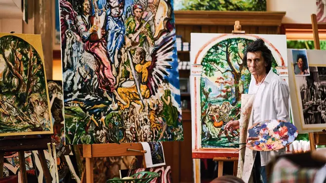 Ronnie Wood painting in his art studio. (Photo by Julian Broad.)
