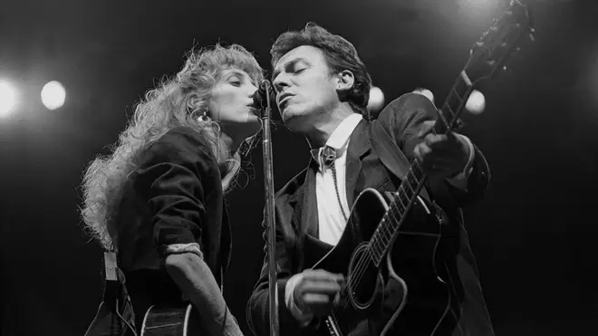 Patti Scialfa and Bruce Springsteen performing on stage together in 1988. (Photo by John Atashian/Getty Images)
