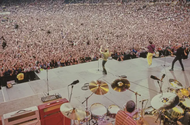 The Wembley Stadium crowd was at full capacity for Bryan Adams' epic performance in 1996. (Photo by Mick Hutson/Redferns/Getty Images)