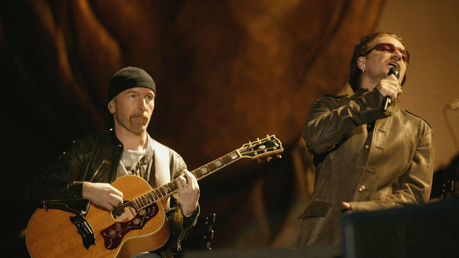 Bono performing in Cape Town with U2 bandmate The Edge. (Photo by Dave Hogan/Getty Images)