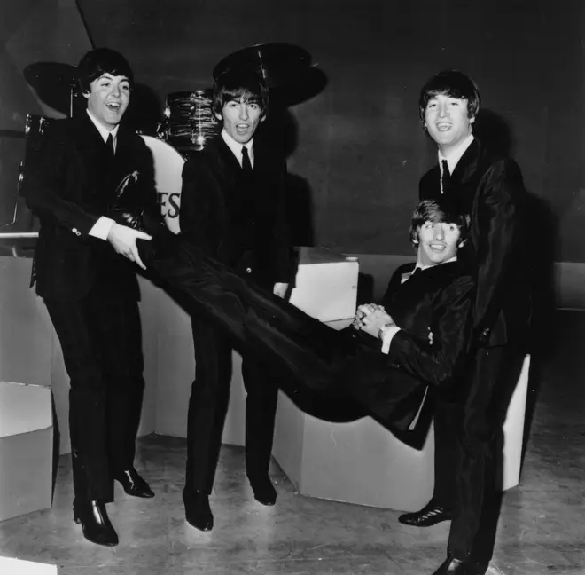 John, Paul and George giving Ringo the bumps in 1964. (Photo by Larry Ellis/Express/Getty Images)