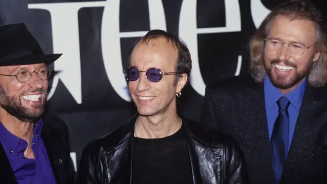 Brothers Maurice, Robin and Barry Gibb of the Bee Gees together back in 1998. (Photo by Nicky J. Sims/Redferns)