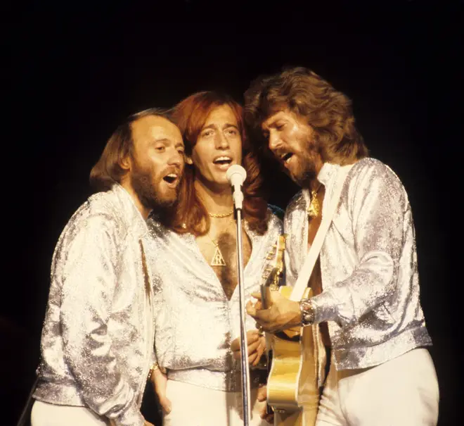 The Bee Gees made their way to pop superstardom after their move to America. (Photo by Ed Perlstein/Redferns/Getty Images)