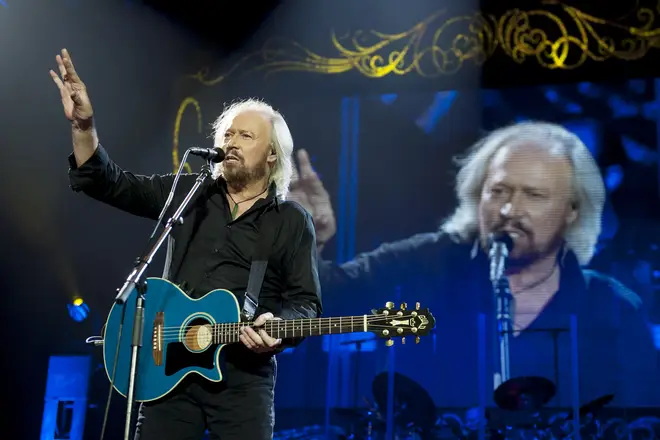 Barry Gibb performing during his Mythology Tour at London's O2 Arena in 2013. (Photo by Neil Lupin/Redferns via Getty Images)