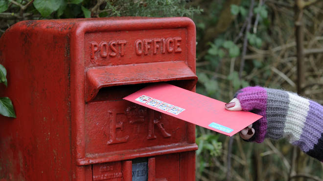 Airmail letter being posted