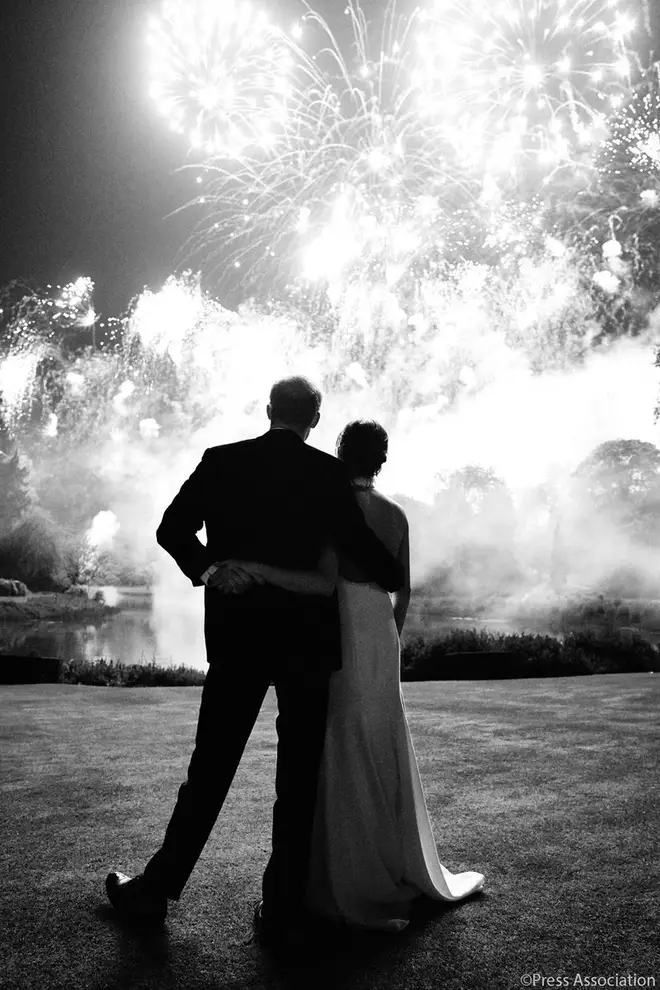 Prince Harry and Meghan Markle, the Duke and Duchess of Sussex look ahead at fireworks in Windsor