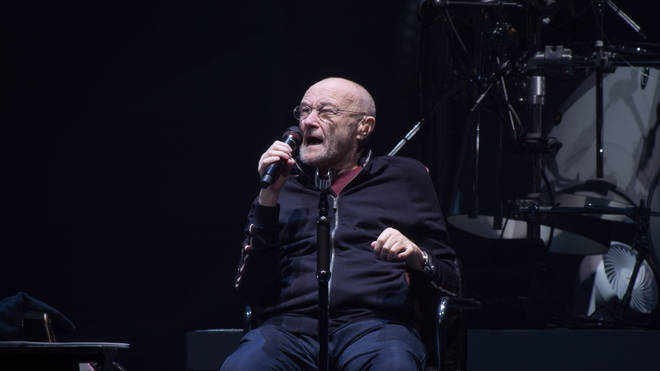 Phil Collins performing with Genesis in 2022