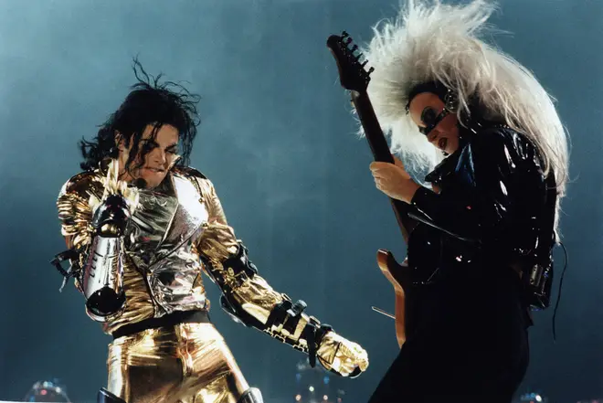 Jennifer Batten performing on stage with Michael Jackson. (Photo by Michel Linssen/Redferns)