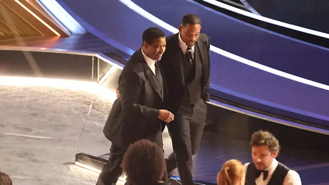 Denzel Washington comforts Will Smith after the slap