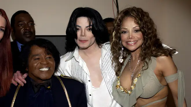 La Toya with brother Michael and James Brown