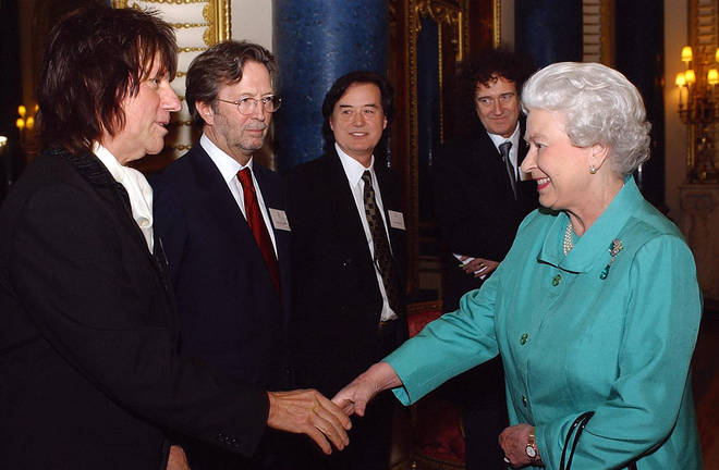 (L to R) Jeff Beck, Eric Clapton, Jimmy Page and Brian May line up to meet the Queen in 2005.