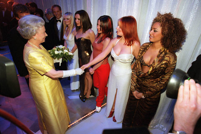 Spice Girl Geri Halliwell (Ginger Spice) shakes hands with the Queen in 1997 as (L to R ) Emma Bunton, Victoria Beckham, Mel C and Mel B (far right) look on