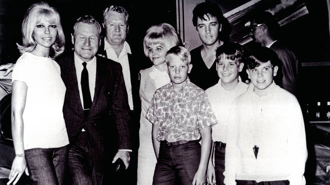 Vernon Presley posing with his second wife Dee ((L-R) Nancy Sinatra, Nelson Rockefeller, Vernon Presley, Dee Presley, Ricky Stanley, David Stanley, Billy Stanley)