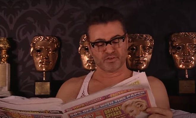 Rickey Gervais proceeds to send up Gordon Ramsay and George Michael - both of whom guest starred on his Extras Christmas Special - before the camera pans to George Michael sitting up in bed beside him, casually reading the Daily Star.