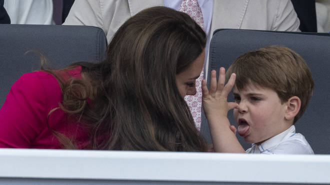 Prince Louis sticks out his tongue