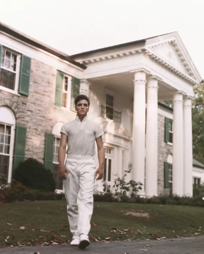 Elvis Presley pictured in front of his Graceland estate in Tennessee, circa 1957.
