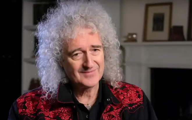 Brian May reflects on footage of John Deacon's final performance