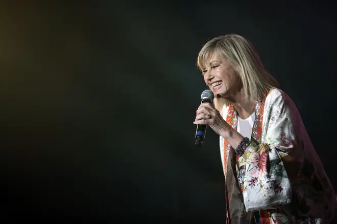 The duo sing 'Two Strong Hearts' before Olivia came back on stage for the finale of 'You're The Voice' with Queen and a team of Australian firefighters.