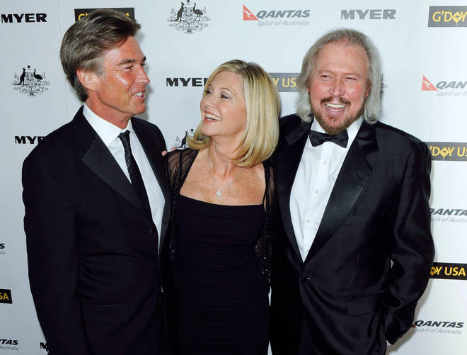 Olivia Newton-John pictured with her husband (left) and Barry Gibb (right) in 2011