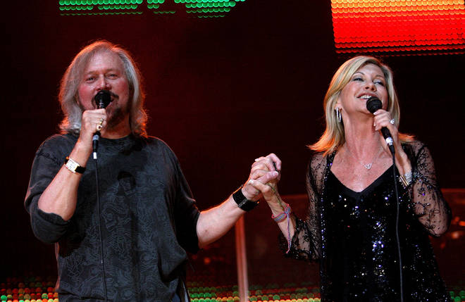 Barry Gibb and Olivia Newton-John pictured performing together in 2009.