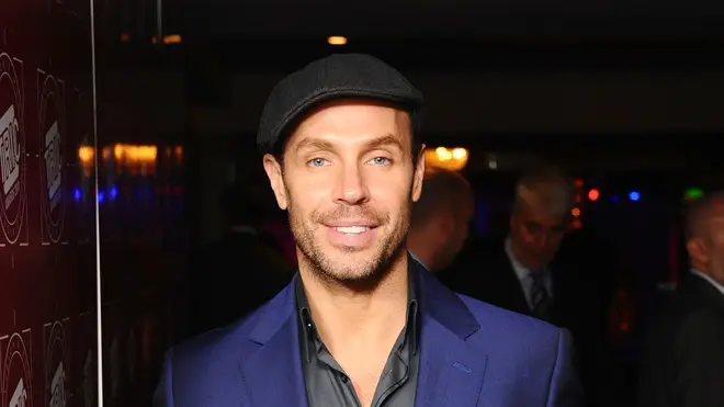 Jason Gardiner throwback picture as he poses in blue suit