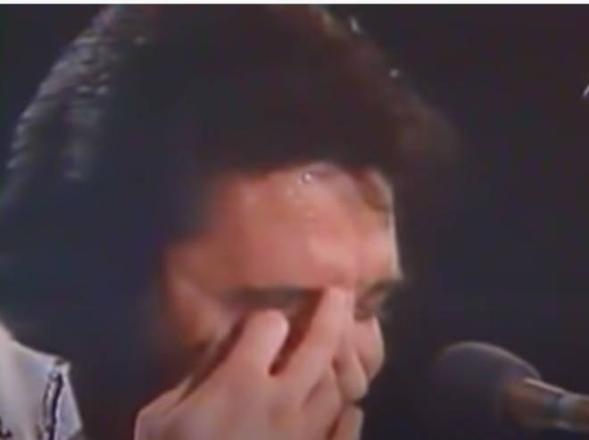 When it comes to the speaking part of the song, Elvis starts to stumble and forget his words, laughing with the crowd over his forgetfulness.