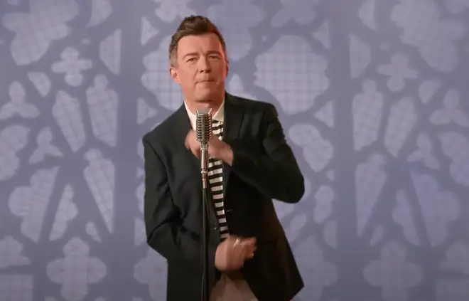 Astley performs in three different outfits that pay tribute to the looks he wore in the original famous music video, but with cameos from zoom and a smart phone in a nod to the video's 21st reincarnation.