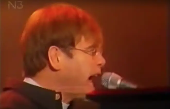 At one point Elton turns and shouts at someone behind him, going back to the microphone with less than a second to spare as he sings the next verse of 'The B*tch Is Back'.