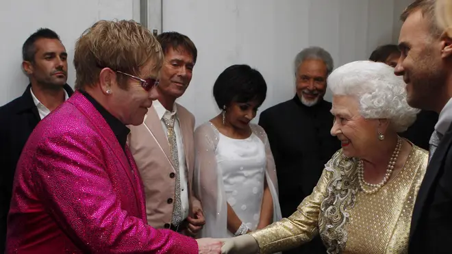 Elton John and Queen Elizabeth II after the Diamond Jubilee Concert in 2012