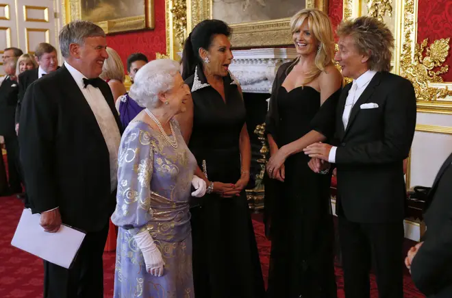 The Queen greets Penny Lancaster and Rod Stewart during a reception for the Royal National Institute for the Blind at St James Palace on June 3, 2013