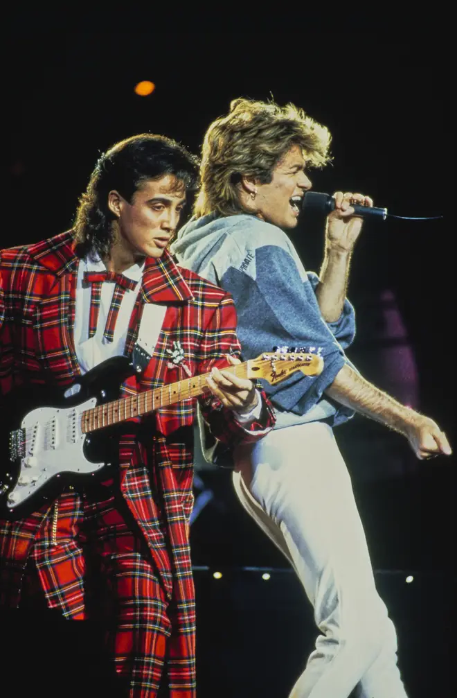 George Michael and Andrew Ridgeley performing together in 1985. (Photo by Michael Putland/Getty Images)
