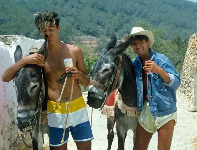 George Michael and Andrew Ridgeley riding donkeys while in Ibizia to record of Club Tropicana at Pikes Hotel in Ibiza on March 16, 1983 in Ibiza, Spain.