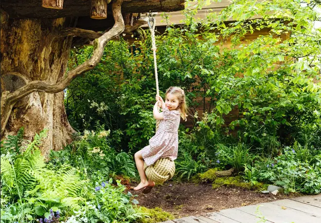 The children take turns to play on the outdoor swing