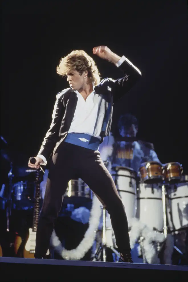 George Michaelof Wham!, performing on stage during the pop duo's 1985 world tour, January 1985
