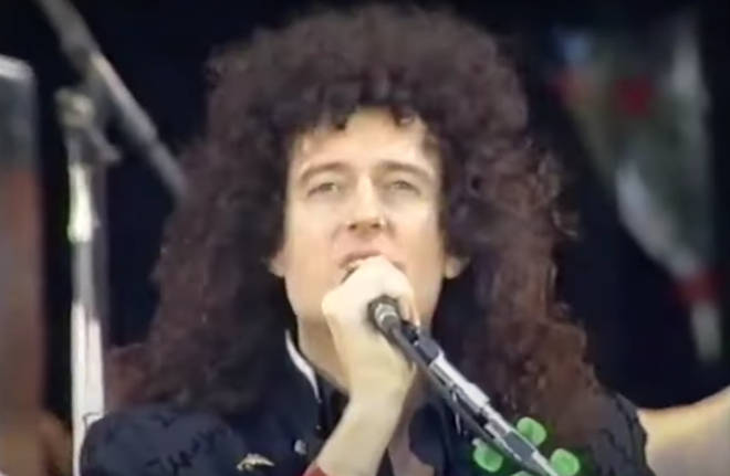 Brian May performs with Queen